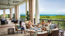Four women sitting outside